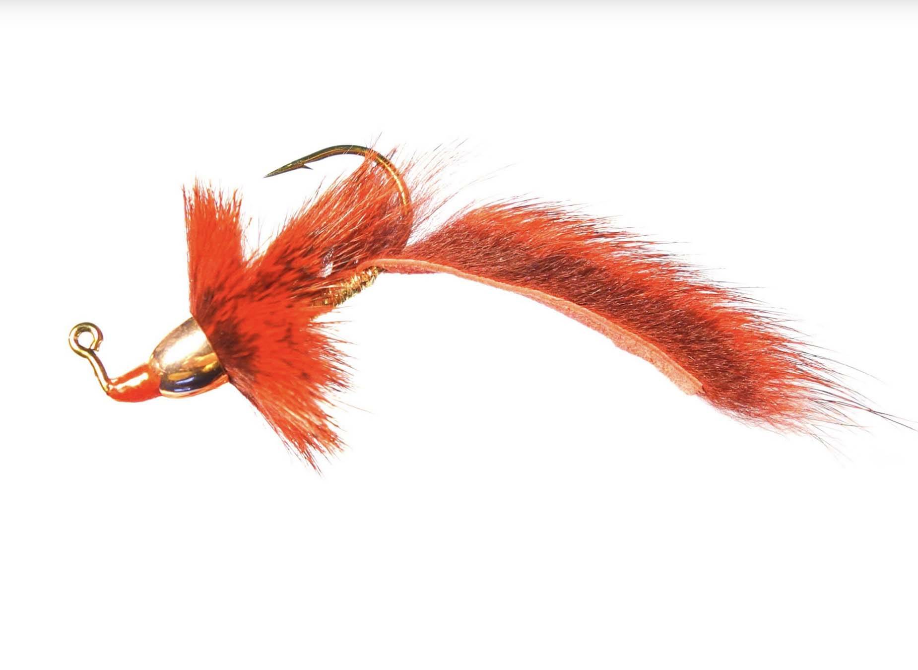 Orange Barr's Jigged Slumpbuster streamer fly with gold bead head on white background